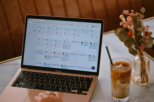 Laptop showing a content calendar on a desk