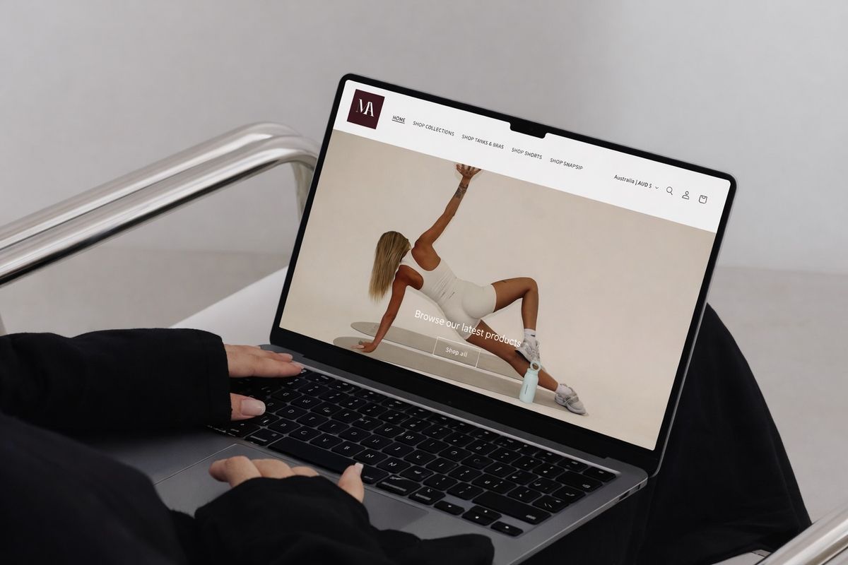 Laptop showing a Shopify storefront built with an AURA Theme Studio template
